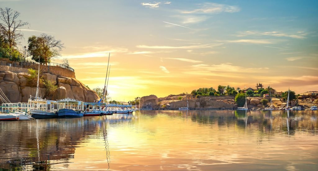 Aswan tours – boats moored on the Nile in Aswan at sunset