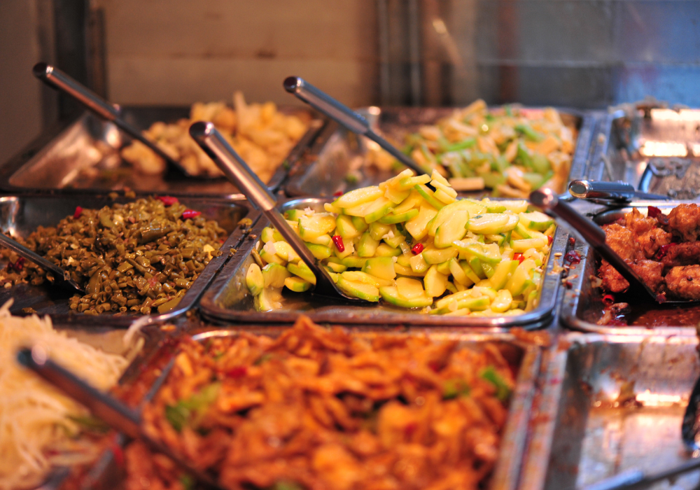 Trays of hot dishes on a dinner buffet