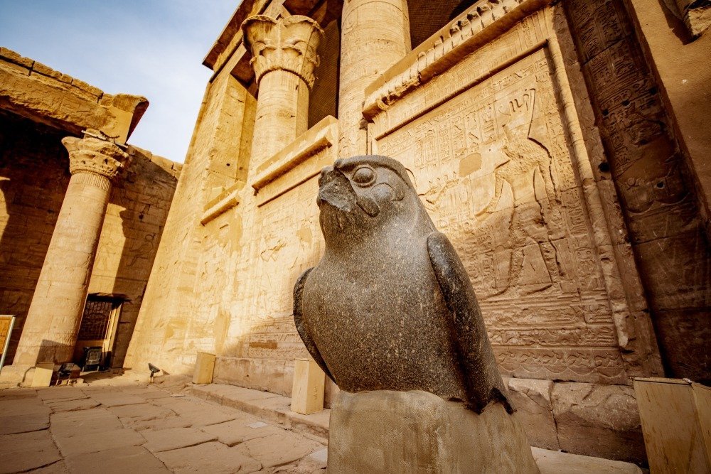 The granite falcon statue of Horus in the Edfu temple courtyard