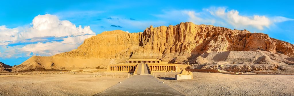 The Temple of Hatshepsut beneath the golden cliffs of Deir el-Bahari
