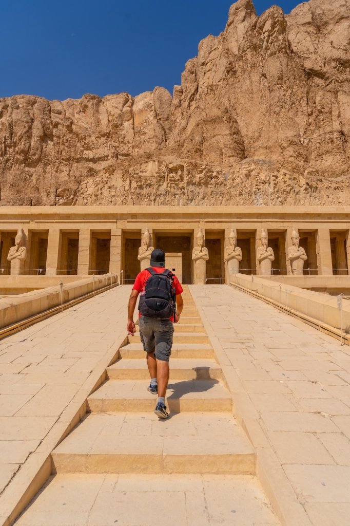 Luxor West Bank private transfer – a traveler climbing the ramp to the Temple of Hatshepsut