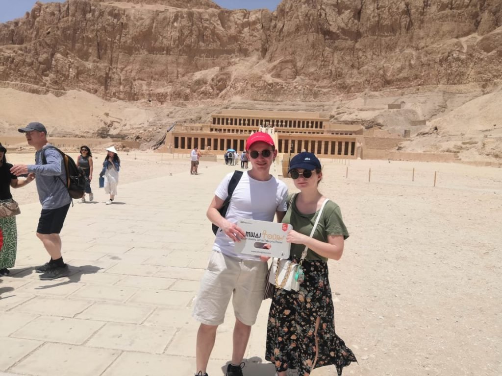 A group of travelers in front of the Temple of Hatshepsut