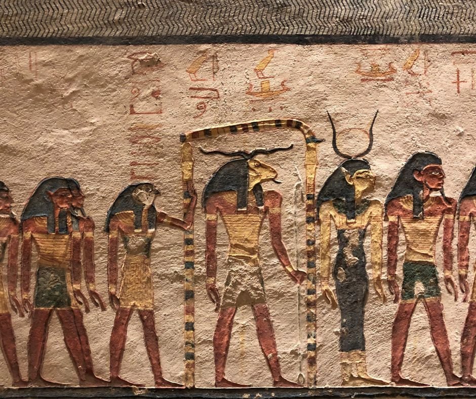 Painted figures of gods on a tomb wall in the Valley of the Kings