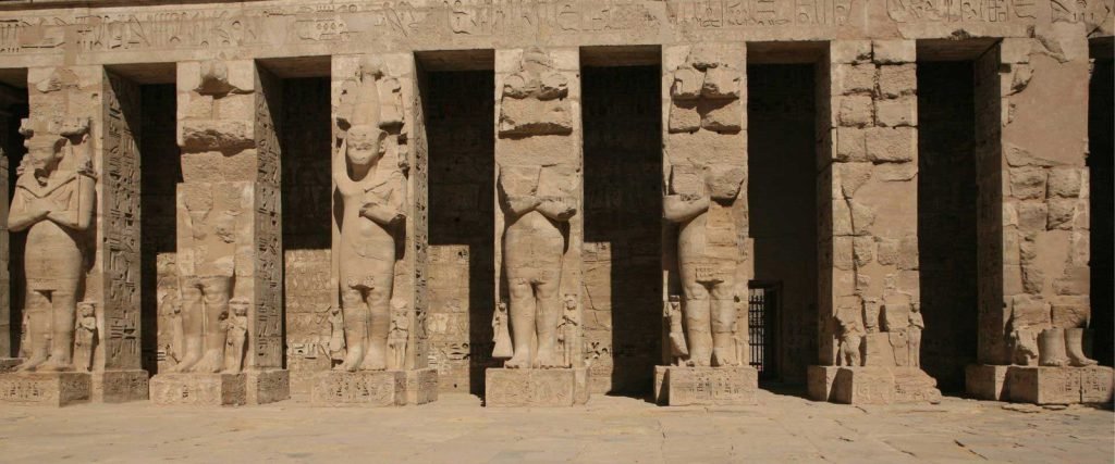 Osiris statues carved on the pillars of Medinet Habu