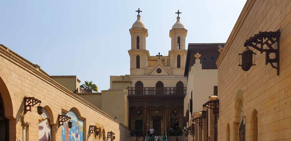 The twin bell towers and facade of the Hanging Church in Old Cairo