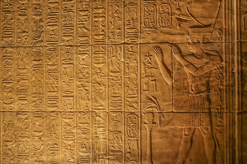 Philae Temple history in stone: hieroglyphs carved on a wall of the Temple of Isis