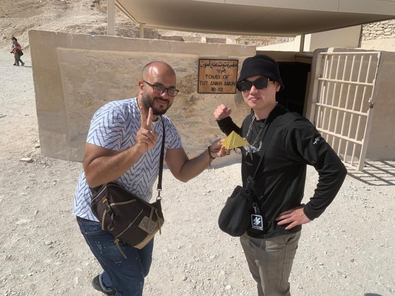 A guide from Amwaj Tour, a Luxor tour company, with a traveler at the tomb of Tutankhamun in the Valley of the Kings