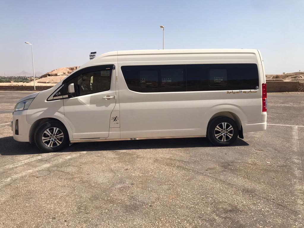 The air-conditioned Amwaj Tour minivan parked and ready for the next trip
